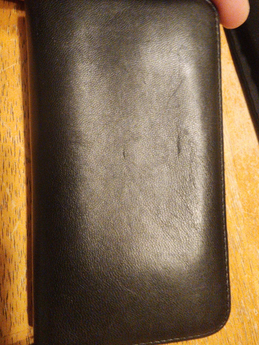 Chanel Timeless CC zip-around wallet features smooth black leather